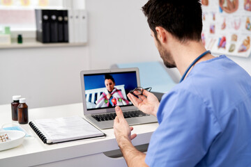 Fototapeta na wymiar Rear view of doctor making an online consultation