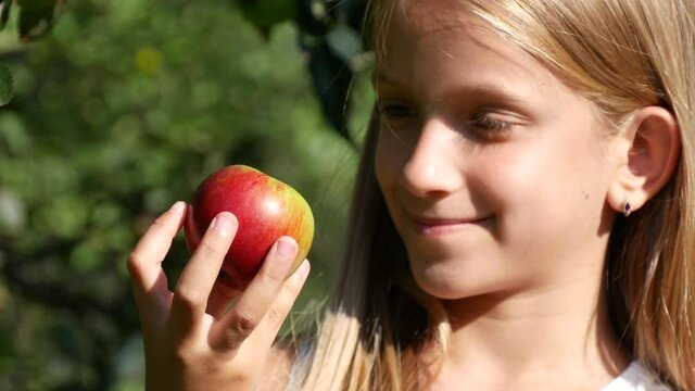 Kid Eating Apple, Child in Orchard, Kid Tasting Fruits in Tree, Farmer Blonde Young Girl at Village at Countryside