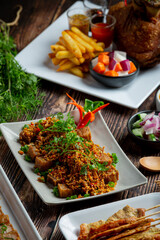 Fried Pork with Dried Chili and Salt on dark background