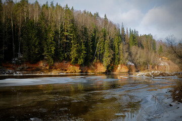 red sand stone by river