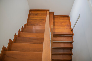 Staircase, wooden floor and black iron rail. - 410084519