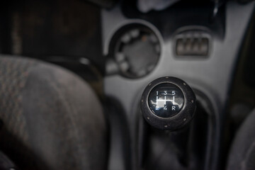 The gear shift lever inside the car