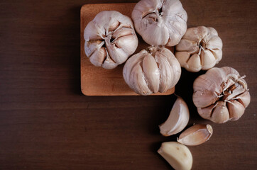Close up white onions on wooden table, top view