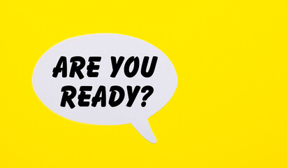 On a bright yellow background, white paper with the words Question ARE YOUR READY