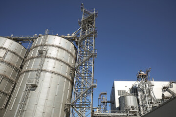 Modern granaries for storing cereal grains outdoors, low angle view