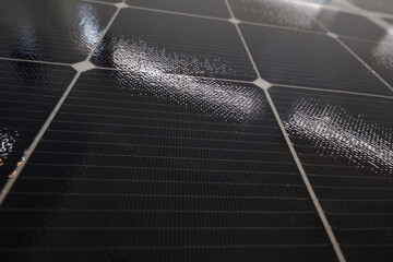 Flat surface of solar panels. Close-up square cells receiving sunlight © gogiya