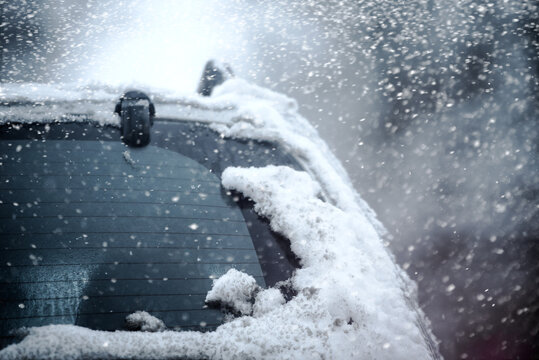 Close-up of a car in the snow in a winter city