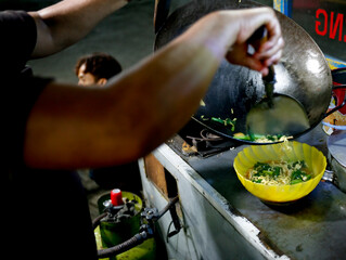 Indonesian hawker street food cooking noodle frying at night