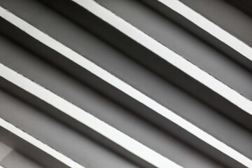 Obraz premium Abstract. Embossed paper white Background, light and shadow. Pattern texture repeating monochrome halftone. Stripes on White background. Black and white.