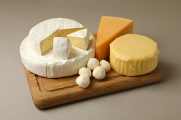 Different fresh dairy products on gray background