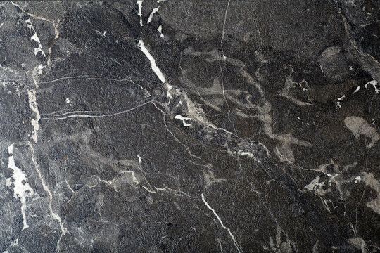 Black marble background. Background with texture and pattern of black stone, marble or granite.