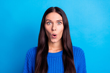 Fototapeta premium Photo of astonished young woman wear knitted blue sweater shocked discount isolated on blue color background