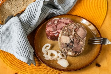 Bright and black pudding with onion on plate