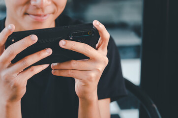 Man hand holding a cell phone white blank mockup