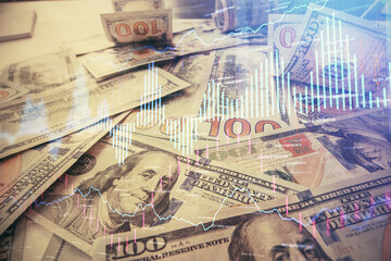 Multi exposure of forex chart drawing over us dollars bill background. Concept of financial success markets.