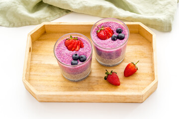Homemade yogurt chia seeds pudding with strawberries in glasses