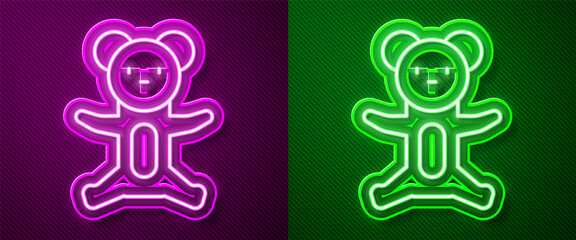 Glowing neon line Teddy bear plush toy icon isolated on purple and green background. Vector.