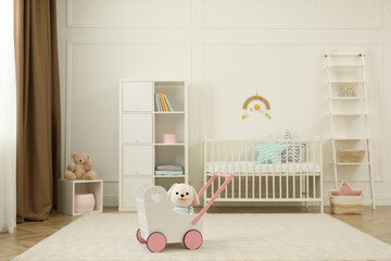 Cute baby room interior with stylish furniture and toys