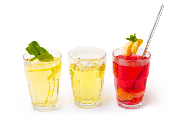 three refreshing drinks in glasses - mint tea, chamomile, fruit and berry isolated