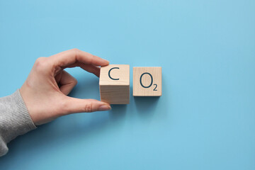 Wooden cubes with icons: oxygen and carbon dioxide. The clean air and the environment