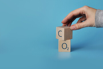Wooden cubes with icons: oxygen and carbon dioxide. The clean air and the environment