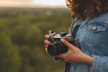 young woman with camera in retro style