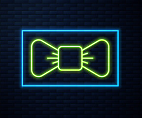 Glowing neon line Bow tie icon isolated on brick wall background. Vector.