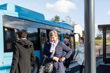 Senior women at bus station