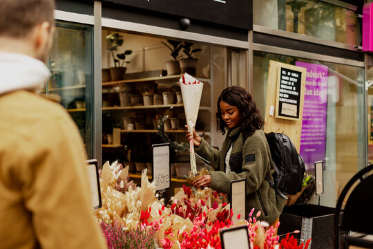 Woman buying flowers