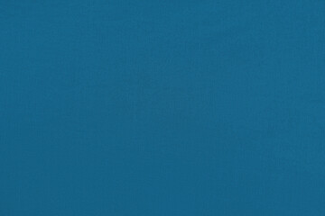 Blue homogeneous background with a textured surface