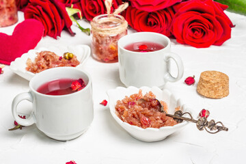 Tea time with rose petals jam and hot beverage