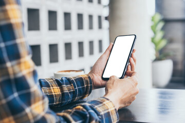 cell phone blank white screen mockup.woman hand holding texting using mobile on desk at office.background empty space for advertise.work people contact marketing business,technology