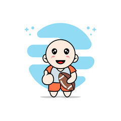 Cute kids character holding a rugby ball.