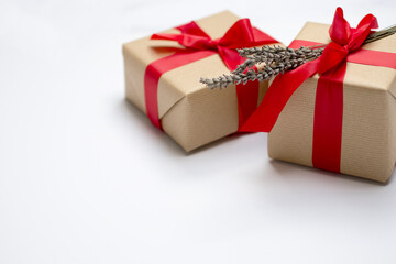 Red gift kraft box with red ribbon and dried lavender. Valentine's Day gift with dried lavender. Natural eco and bio gift. Sensual passion minimal gift with dried lavender bouquet