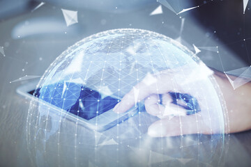 Double exposure of business theme sketch hologram and woman holding and using a mobile device.