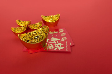 Chinese New Year Concept - Red Envelope and Golden Ingot With Copy Space