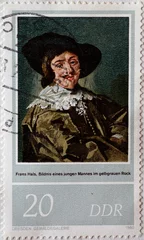 Foto op Canvas GERMANY, DDR - CIRCA 1980 : a postage stamp from Germany, GDR showing a "portrait of a young man in a yellow-gray skirt" for the 400th birthday of Frans Hals © zabanski