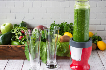 In front of the wall, green fruits and vegetables and a healthy drink blended were prepared. The...