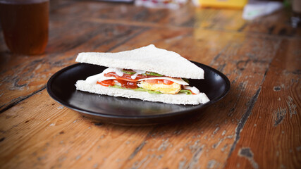 sandwich at plate on top table