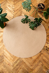 Jute Twine round Mat rug eco style with green plant. Knitted at home decoration concept. round...