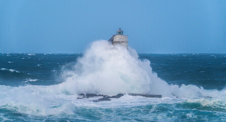 lighthouse of the mangiabarche of calasetta in a stormy day, sardinia
