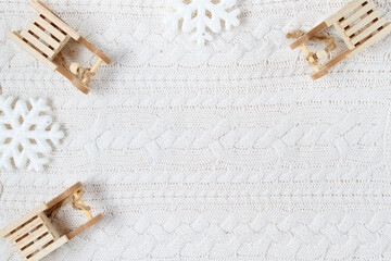 winter flat lay with sleds and snowflakes