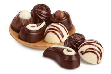 Chocolate candy in wooden bowl isolated on white background with clipping path and full depth of field