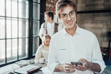 Office business teamwork concept. Portrait of smart guy wearing glasses