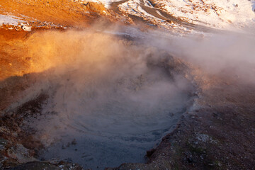 Iceland. Reykjadalur steam valley near Reykjavik, in Iceland with hills covered in white during winter