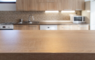 blurred kitchen interior and wooden desk space home background