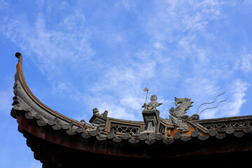 The sculpture on the roof ridge is in Chenxiang Pavilion, Shanghai, China