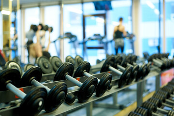 Metal dumbbells for strength training in the gym.