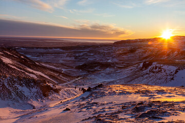Iceland. Reykjadalur steam valley near Reykjavik, in Iceland with hills covered in white during winter