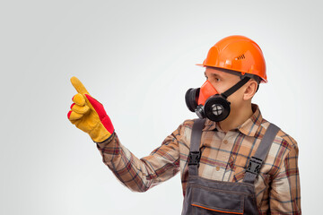 Construction  Worker in Safety Equipment Pointing At Something. Instructs by job safety.